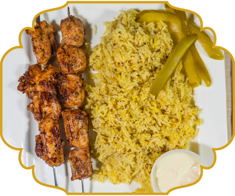 Grilled chicken kabab skewers with saffron rice, pickles, and garlic sauce at That Lebanese Place Springfield